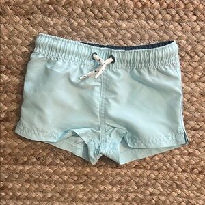 NWT Carters Little Planet swim trunks light blue, 12M